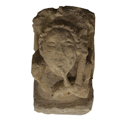 Lot 596 - Two Medieval carved stone corbels, each with a figurehead