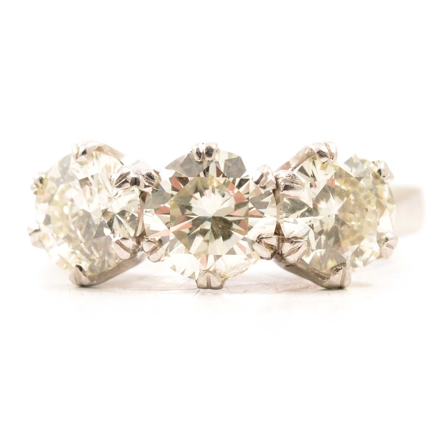 Lot 44 - A diamond three stone ring.