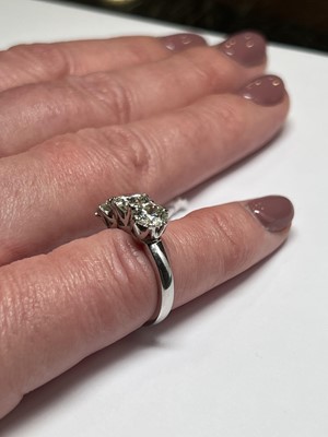 Lot 44 - A diamond three stone ring.