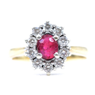Lot 8 - A ruby and diamond cluster ring.