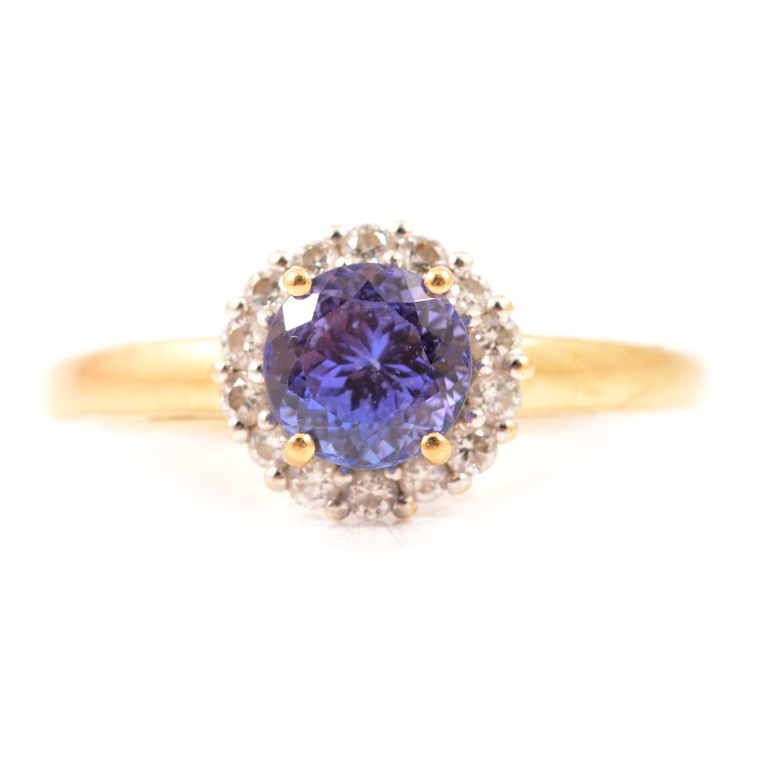 Lot 27 - A tanzanite and diamond cluster ring.