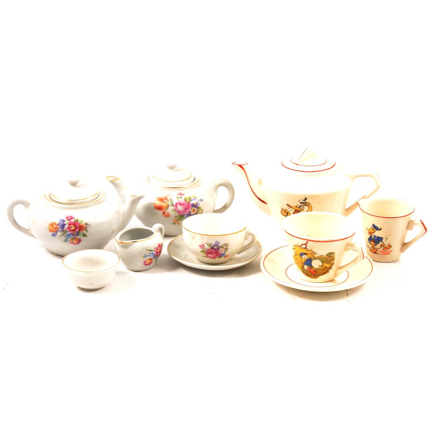 Lot 47 - Pottery toy teaset, printed with Donald Duck, another Continental pottery toy teaset.