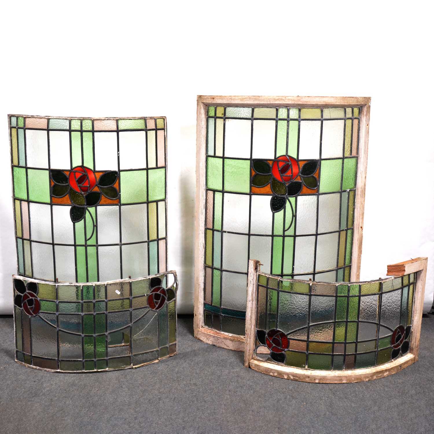 Lot 152 - Two large bowed leaded and stained glass windows, in the Arts and Crafts style