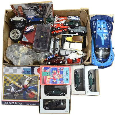 Lot 84 - A box containing die-cast model vehicles, Kidztech RC car, Schylling Rocket Ride Carousel, etc.