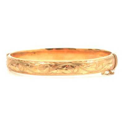 Lot 225 - A 9 carat yellow gold half hinged bangle.