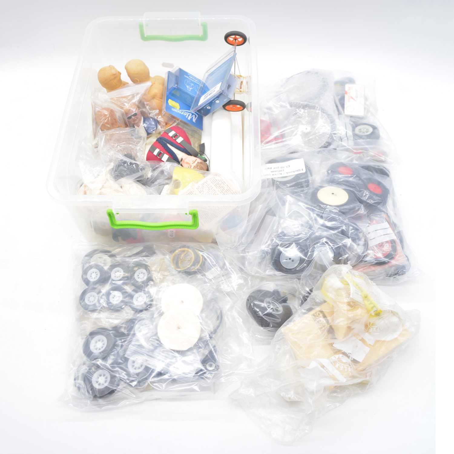 Lot 492 - A box containing model aircraft wheels figures and spares