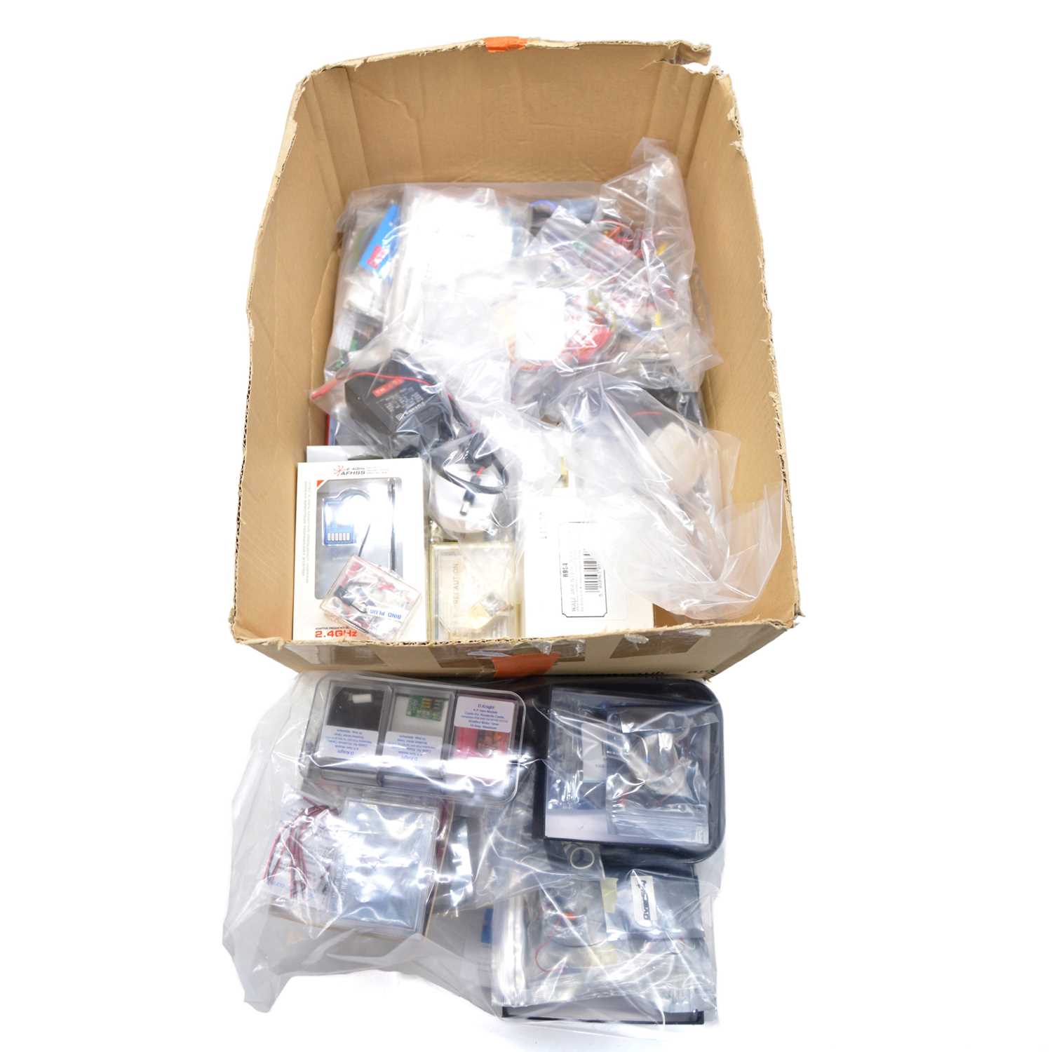 Lot 472 - A box of model aircraft electronics and motors, including Hitec, Graupner and others