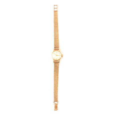 Lot 413 - Longines - a lady's yellow gold bracelet wristwatch.