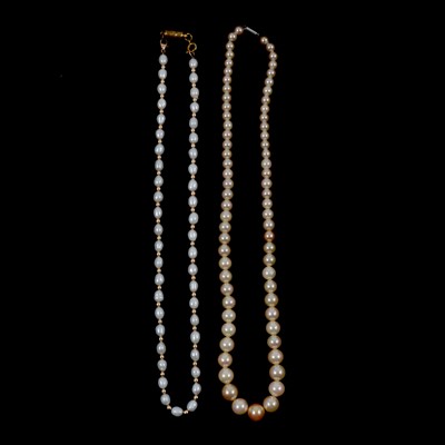 Lot 299 - A freshwater pearl necklace, a cultured pearl necklace, bracelet, earrings and pendant.