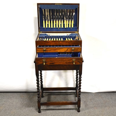 Lot 569 - Canteen of silver plated cutlery and an oak table