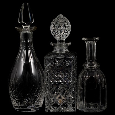 Lot 72 - Twelve glass decanters and a silver-plated claret jug.