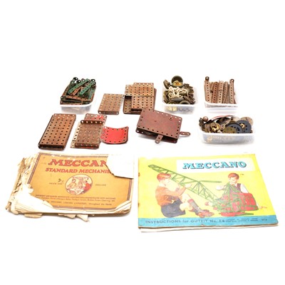 Lot 155 - A box of loose Meccano, including no.1 clockwork motor, with Meccano catalogues and other magazines