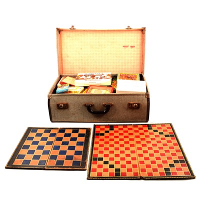 Lot 200 - A vintage suitcase containing vintage games and playing cards, boards etc.