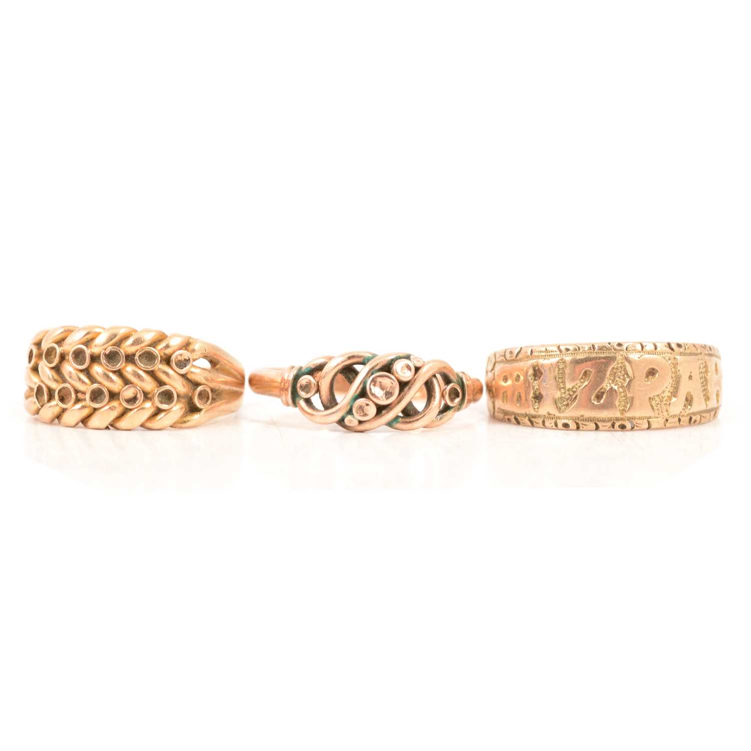 Lot 125 - Two gold curb and shot rings, and a gold