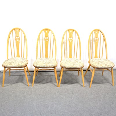 Lot 24 - A 'Burford' extending dining table with six Swan-back chairs, by Ercol