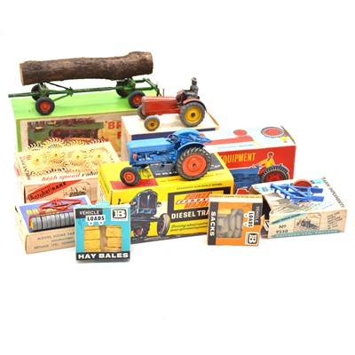 Lot 114 - Nine Britains farm equipment models, mostly boxed, with Crescent plough