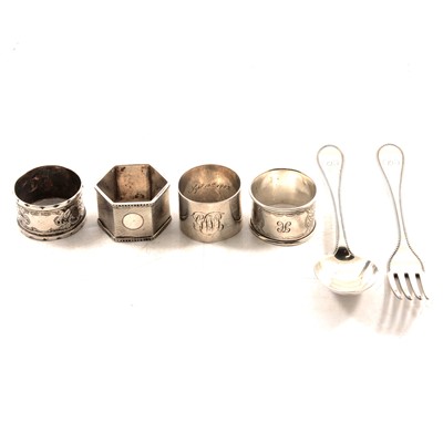 Lot 302 - Four silver napkin rings and a Victorian silver bead edge fork and spoon.