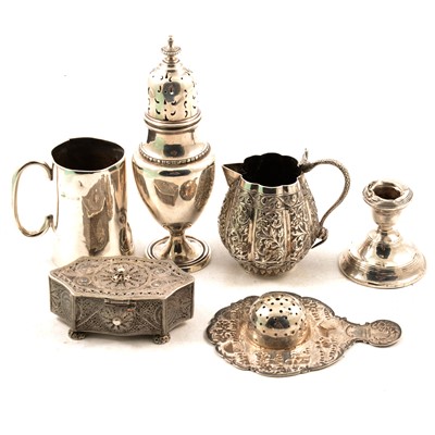 Lot 307 - A silver sugar caster, candlestick, white metal tea strainer