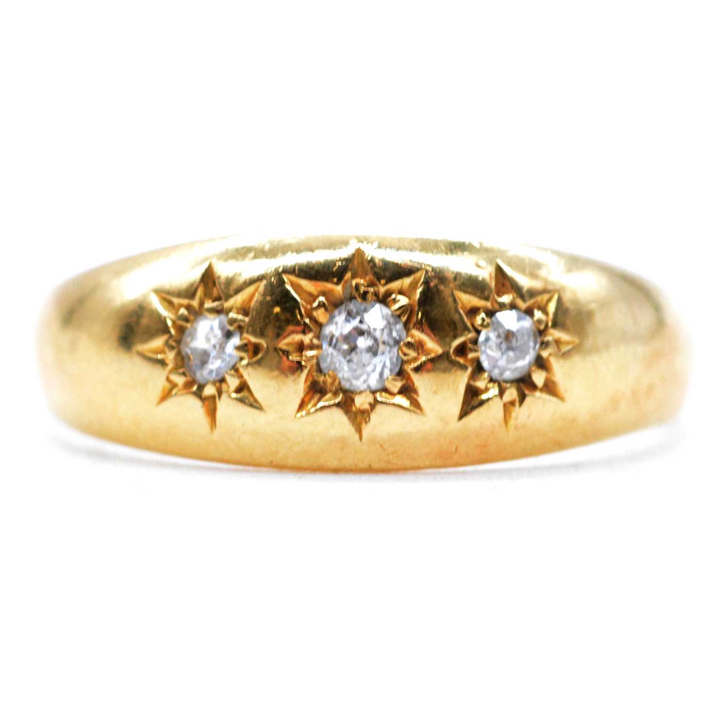 Lot 60 - A diamond star gypsy set ring.