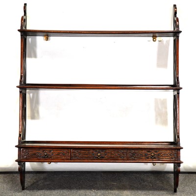 Lot 427 - Set of mahogany open wall shelves in the Chippendale style