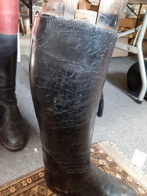 Lot 122 - Three pairs of hunting boots, wooden trees and a hunting crop.