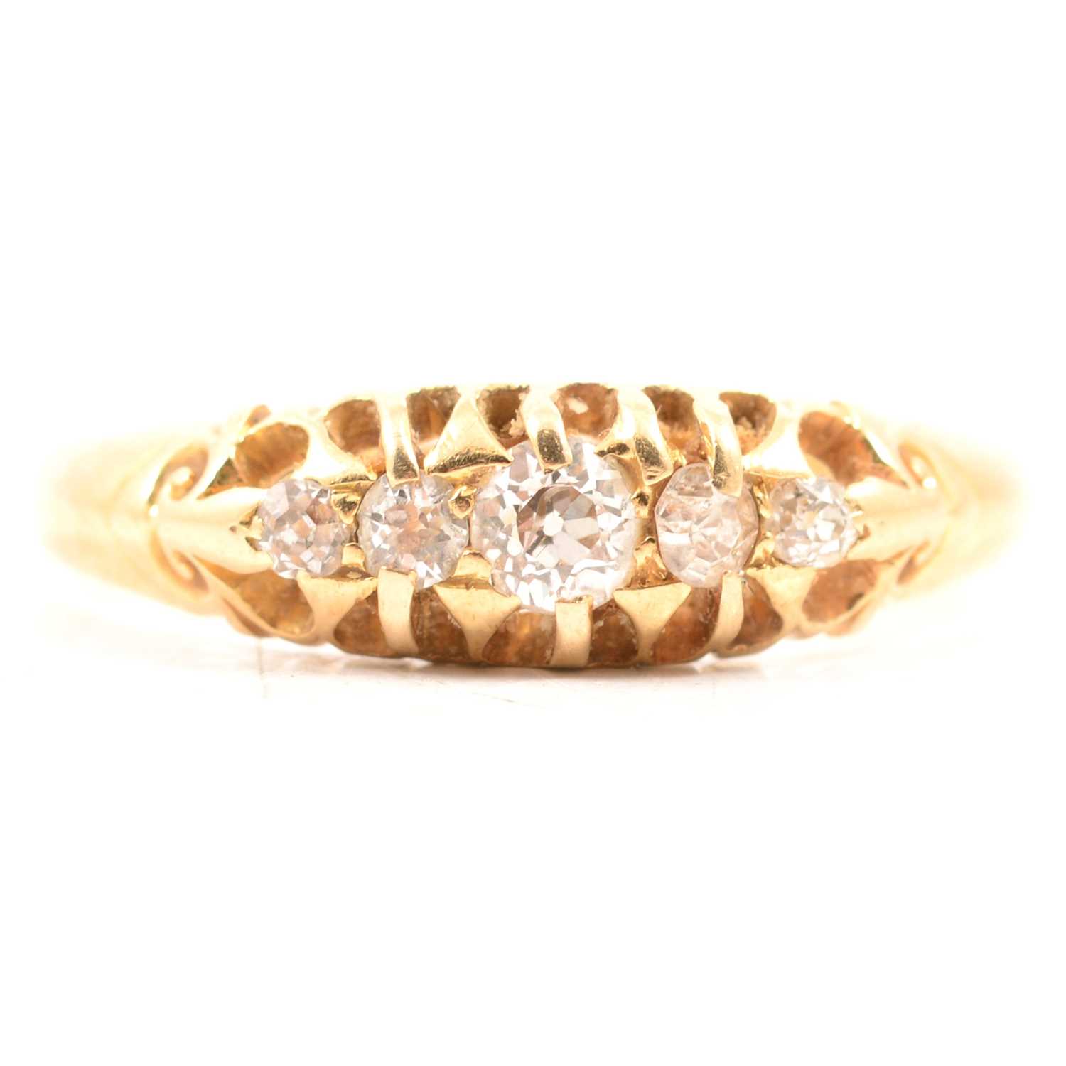 Lot 59 - A diamond five stone ring.