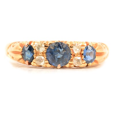 Lot 56 - A sapphire and diamond half hoop ring.