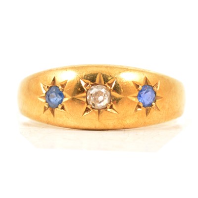Lot 22 - A sapphire and diamond gypsy set ring.