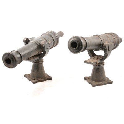 Lot 215 - Two table-top cast iron cannons