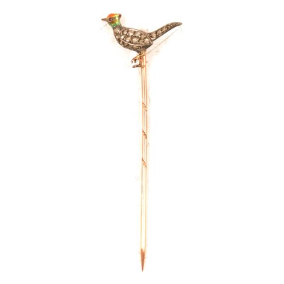 Lot 324 - A diamond and enamel pheasant tie pin.