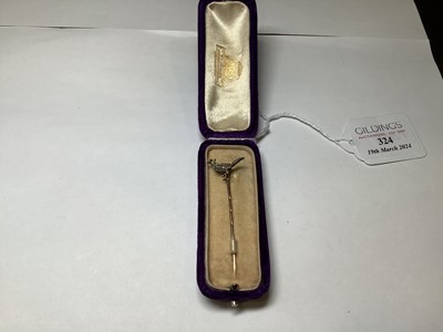 Lot 324 - A diamond and enamel pheasant tie pin.
