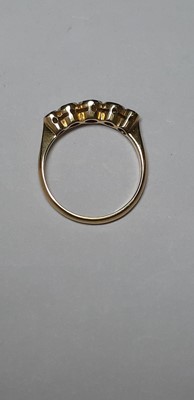 Lot 56 - A diamond five stone ring.