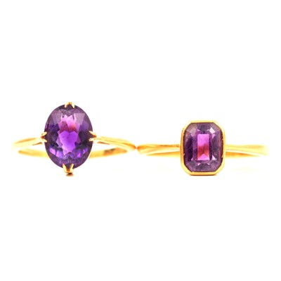 Lot 72 - Two amethyst solitaire dress rings.