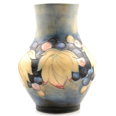 Lot 7 - A William Moorcroft salt glazed vase in the Leaf and Berries design.