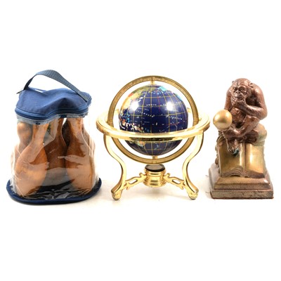 Lot 145 - Small table globe, carpet skittles, and a sculpture of a Darwin Monkey thinking