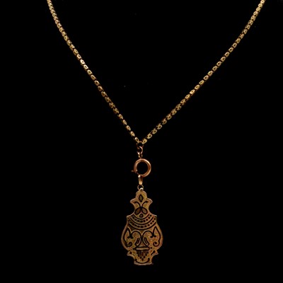 Lot 279 - CATALOGUE AMENDMENT NOT GOLD den Victorian yellow metal guard chain with an enamelled locket.