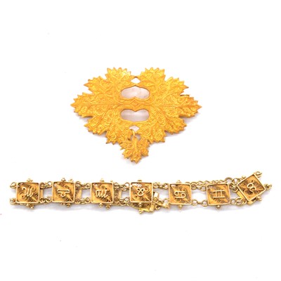 Lot 247 - A yellow metal filigree zodiac bracelet and brooch with single earrings forming a dropper.