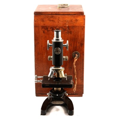 Lot 154 - A C Baker black microscope number 31255, with objectives in fitted case and box of slides.