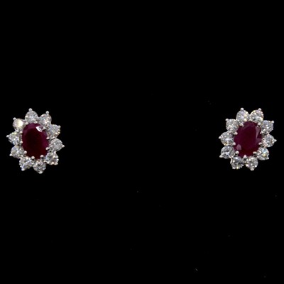 Lot 11 - A pair of ruby and diamond earrings.