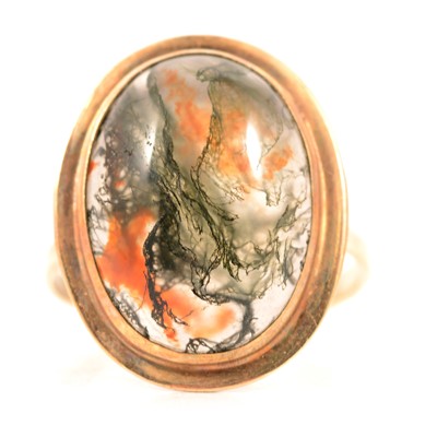 Lot 76 - A moss agate dress ring.