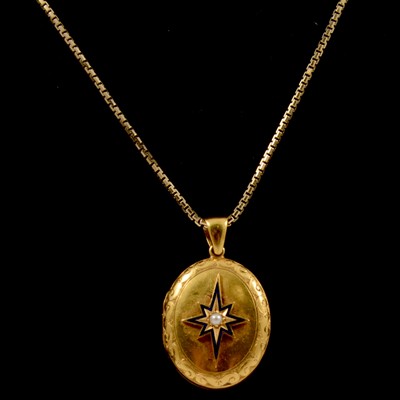 Lot 262 - A yellow metal oval locket and chain.