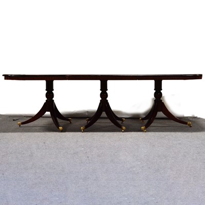 Lot 515 - Reproduction mahogany triple pedestal table