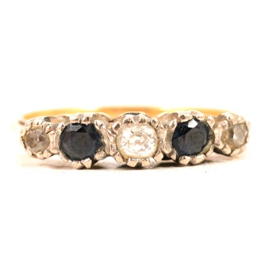 Lot 54 - A sapphire and diamond half hoop ring.