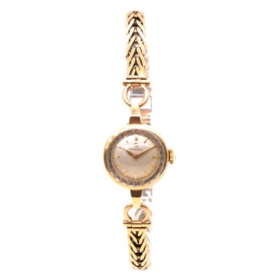 Lot 404 - Omega - a lady's 9 carat yellow gold bracelet wristwatch.