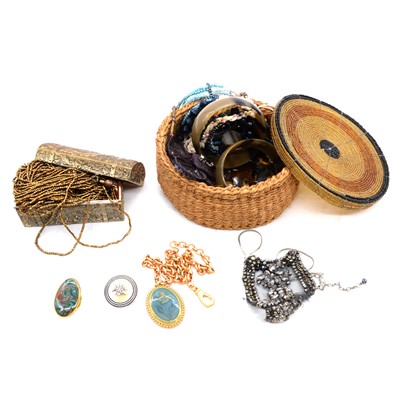 Lot 481 - A beaded basket and brass finish jewel casket with costume jewellery.