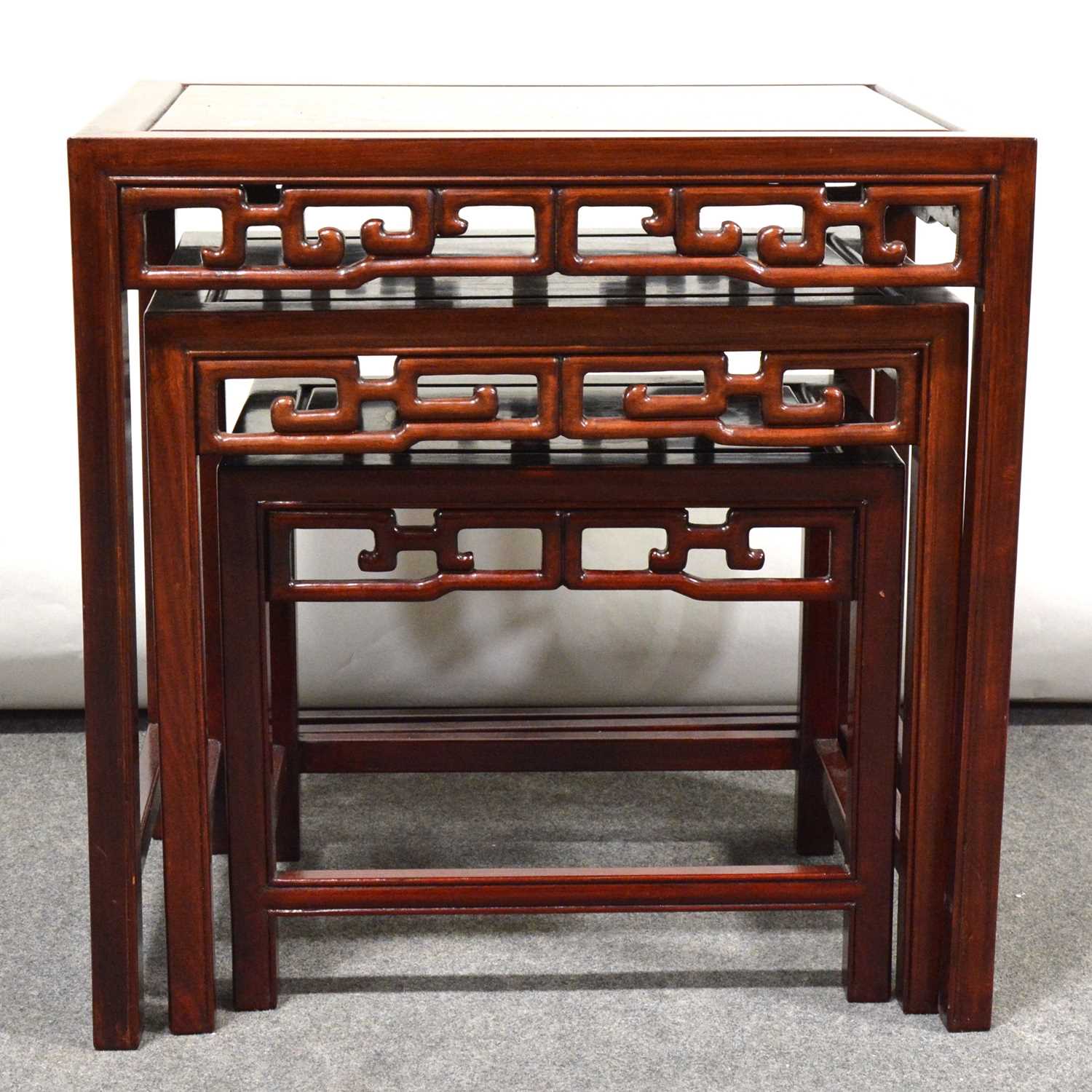 Lot 560 - Nest of three Chinese hardwood tables,