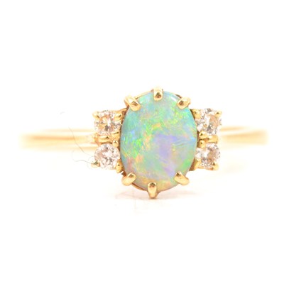 Lot 78 - An opal and diamond dress ring.