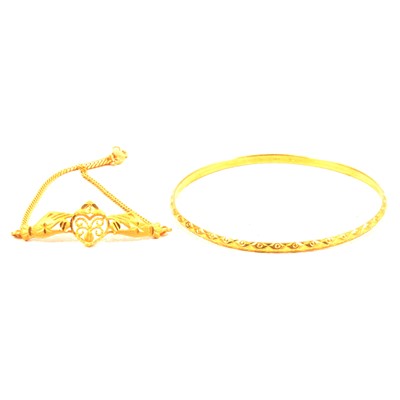 Lot 222 - A 22 carat yellow gold narrow bangle and a 916 link bracelet.