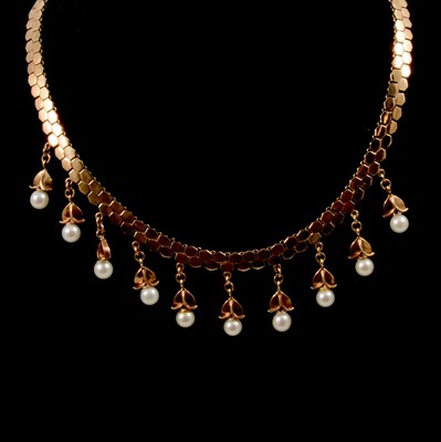 Lot 291 - A 9 carat yellow gold fringe necklace with pearl drops.