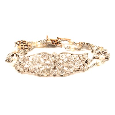 Lot 232 - A diamond and seed pearl bracelet.